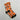 Calcetines de Halloween personalizados con la cara de un niño sobre fondo naranja calabaza, con lettering Truco o Trato, calabaza, fantasma y sombrero de bruja