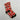 Calcetines de Navidad personalizados con la cara de un niño repetida sobre fondo rojo, con lettering Feliz Navidad, bolas de árbol y gorros de Papá Noel