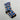 Calcetines de reno personalizados con la cara del cliente sobre fondo azul, con astas, el reno de nariz roja, la zanahoria y el trineo